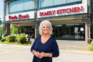 Paula Deen in front of her restaurant